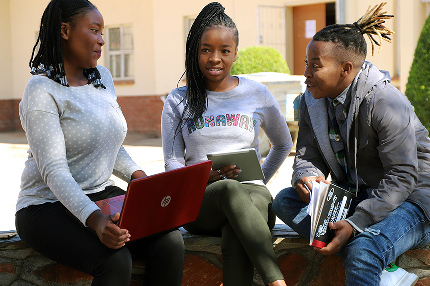 students outside auditorium